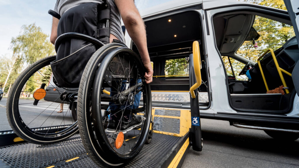 wheelchair user entering taxi