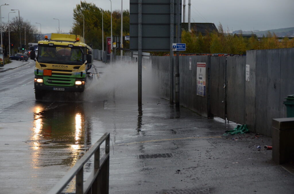 Lorry splashing a pavement