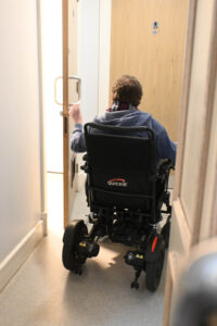 Evander opening a door at AK Bell Library