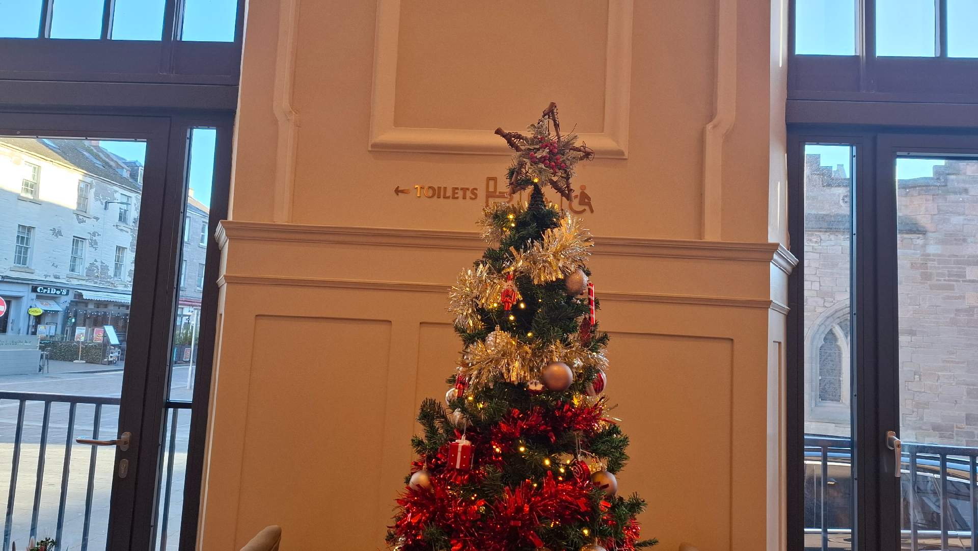 Christmas Tree blocking Toilet Signage