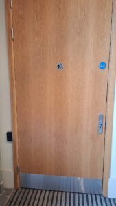 Tiny signage on door for a Changing Place