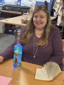 Cindy at CATH CONNECT making a bottle decoration with Lights