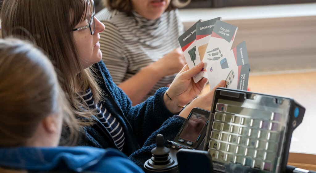 People playing a card game highlighting inclusivity